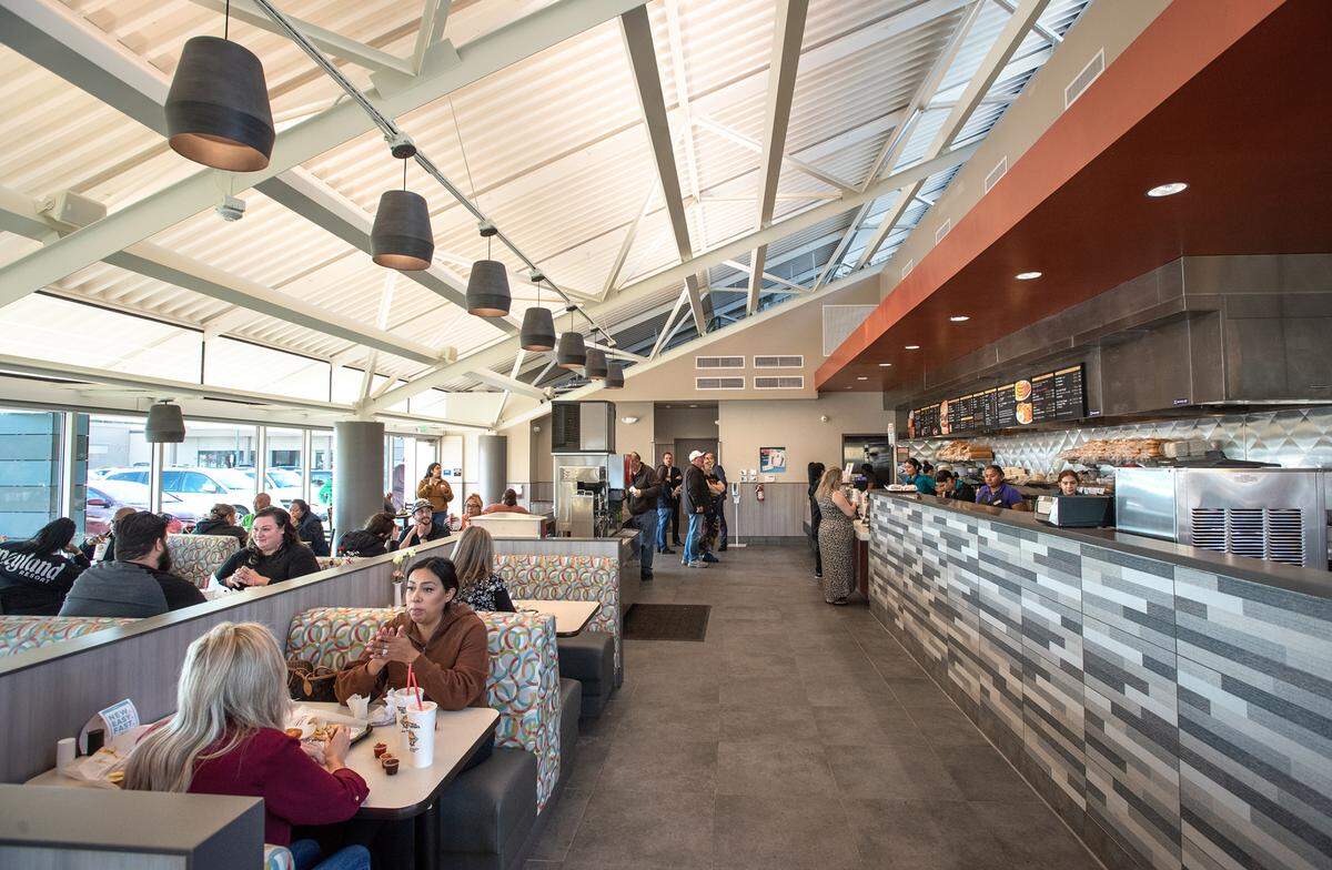 Customers eat lunch at Nation’s Giant Hamburgers on McHenry Avenue in Modesto, Calif., Wednesday, Nov.16, 2022.