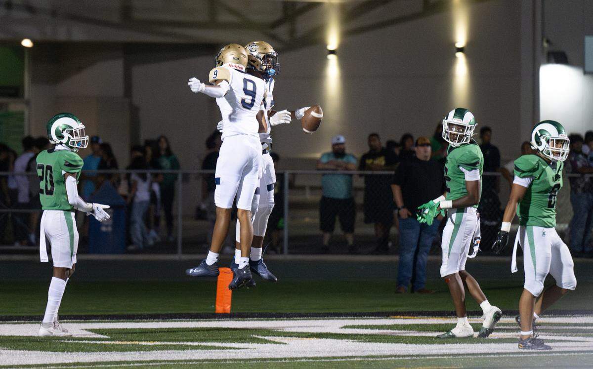 Central Catholic’s Joey Alcutt and Scotty Hallmon (9) celebrate a touchdown during the game with St. Mary’s in Stockton, Calif., Friday, August 25, 2023.