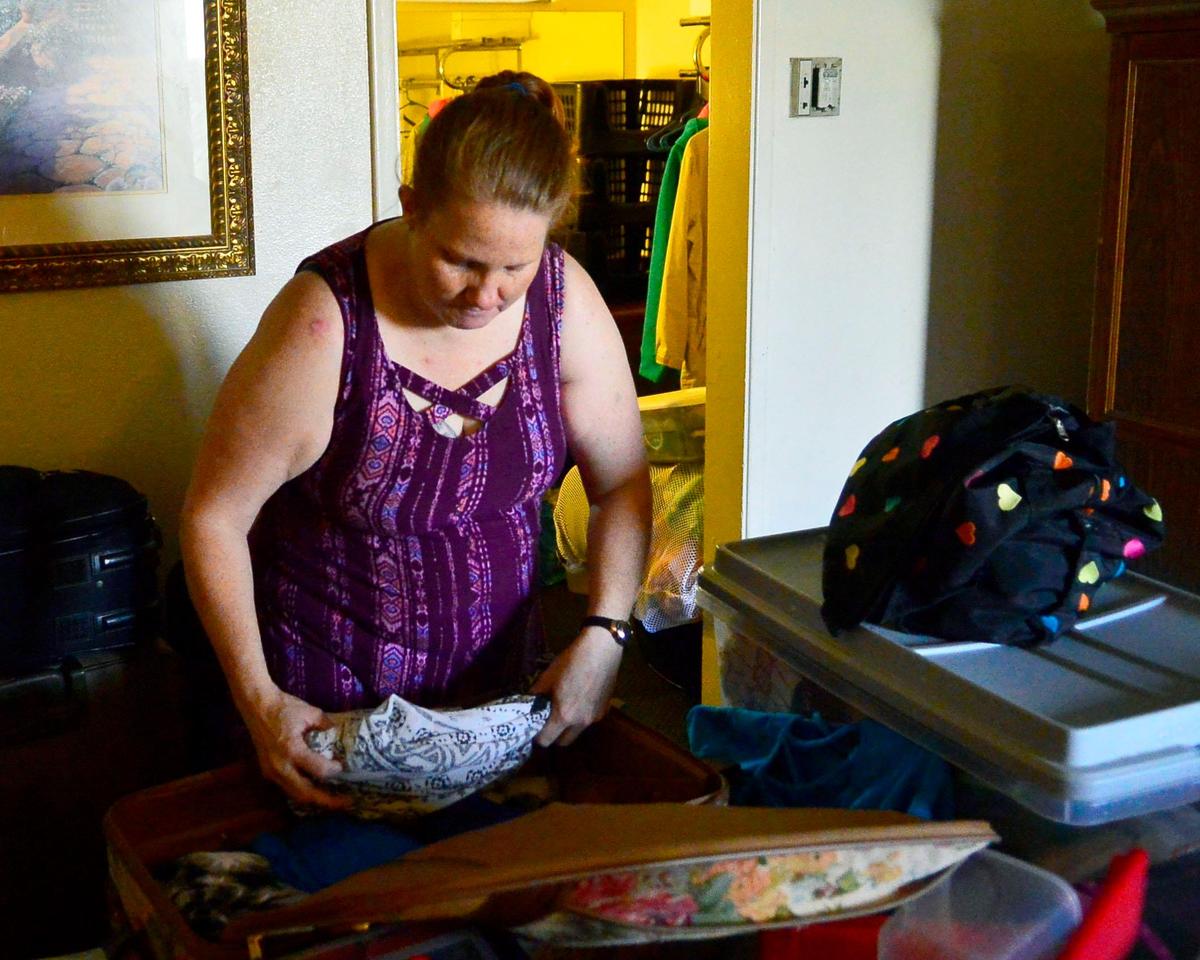 Anita Hayes packs up her family’s belongings after being evicted by the Budgetel Inn & Suites on McHenry ave due to the business’s closure on January 26, 2019 in Modesto California.