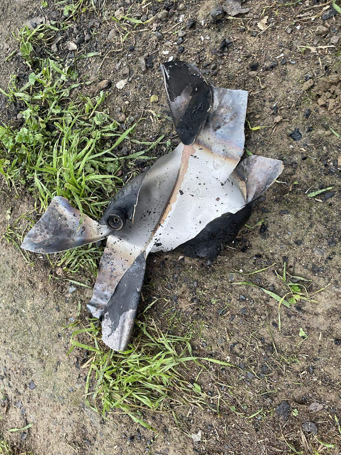 Debris from a propane tank lies on the ground after an explosion sparked a fire on the 1200 block of Roselawn Avenue in Modesto on Friday. Two adults suffered burn injuries and were taken to local hospitals, fire officials said.
