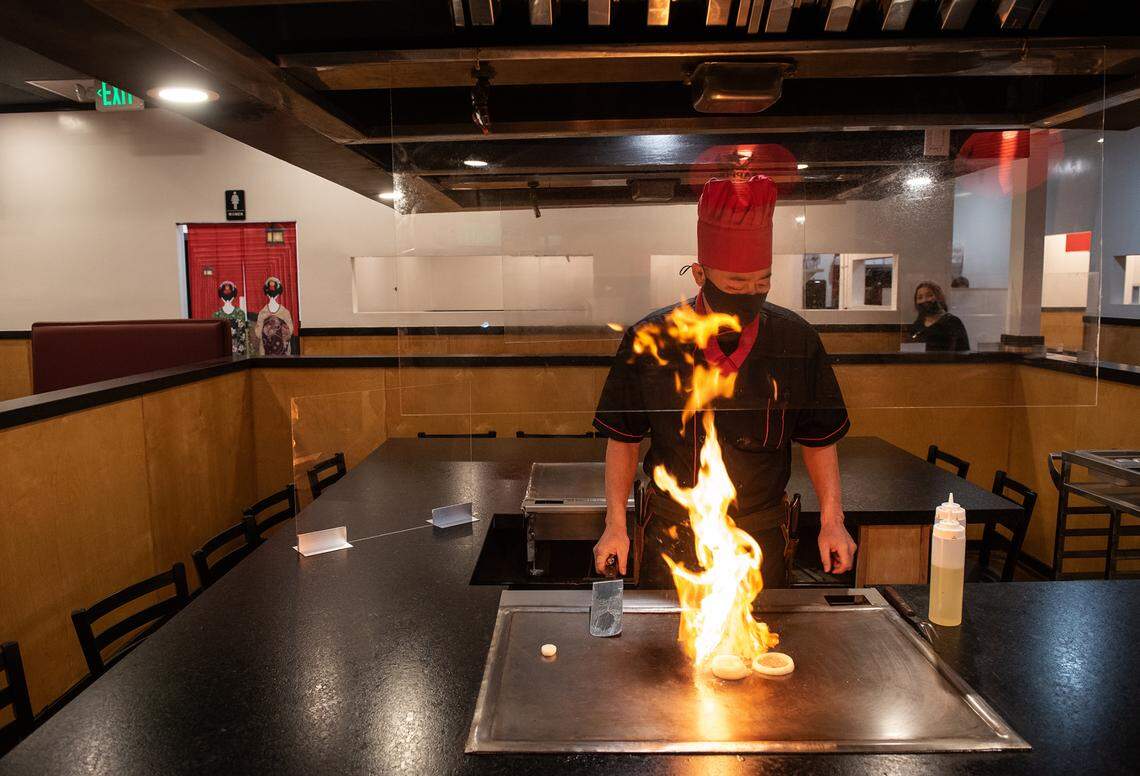 George Chen works the teppanyaki at Torii Japanese Restaurant at Century Center in Modesto, Calif., on Thursday, Nov. 12, 2020.