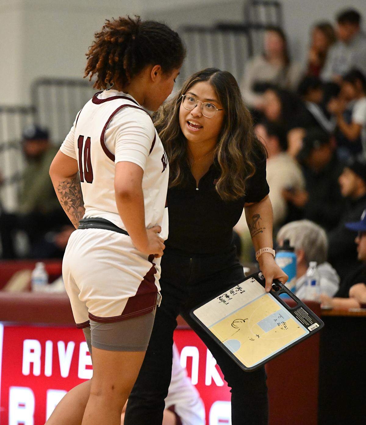 Riverbank coach Janelle Luu talks with Chancis Gamez during the CIF Northern California Division IV playoff game with Notre Dame at Riverbank High School in Riverbank, Calif., Thursday, Feb. 29, 2024.