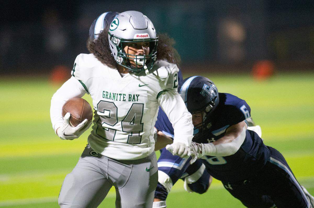 Granite Bay’s Isaiah Ene breaks free on a kick return during the CIF Sac-Joaquin Section Division II playoff game with Downey at Downey High School in Modesto, Calif., Friday, Nov.11, 2022.