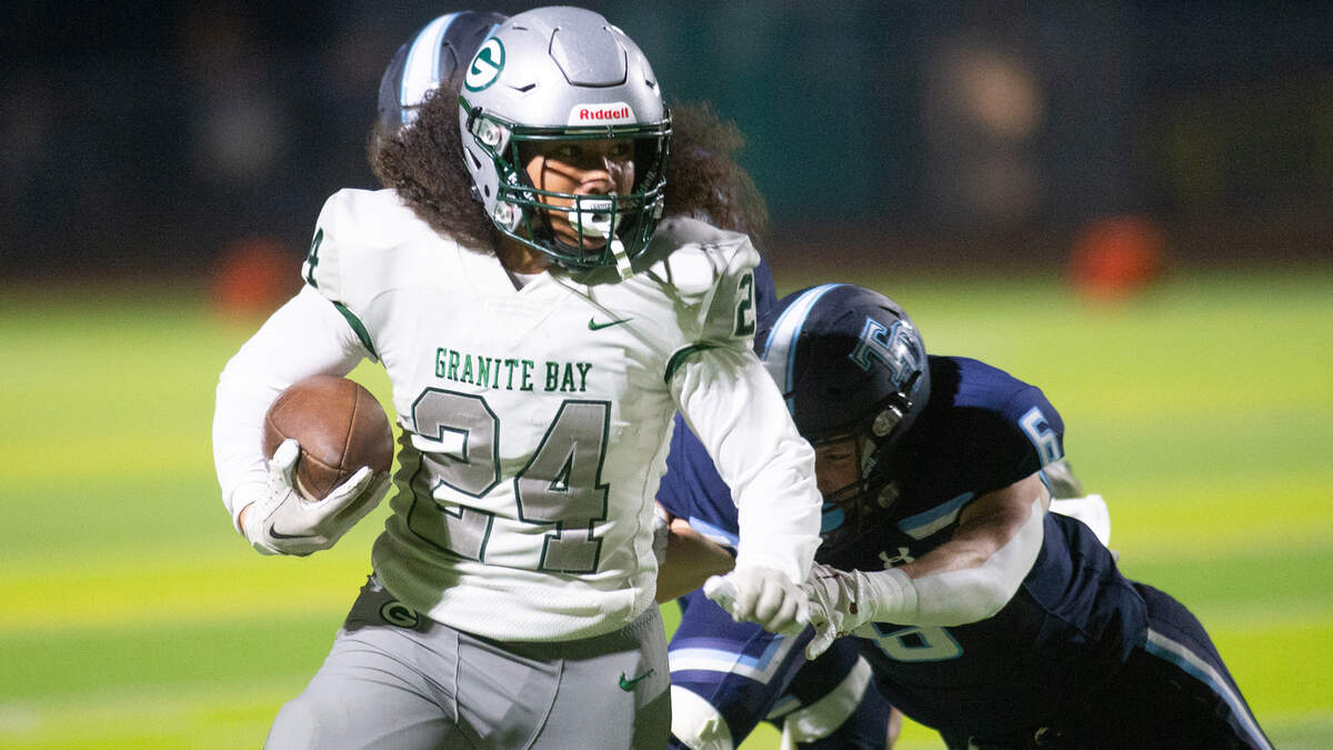 Granite Bay’s Isaiah Ene breaks free on a kick return during a CIF Sac-Joaquin Section Division II playoff game against Downey on Nov. 11, 2022.