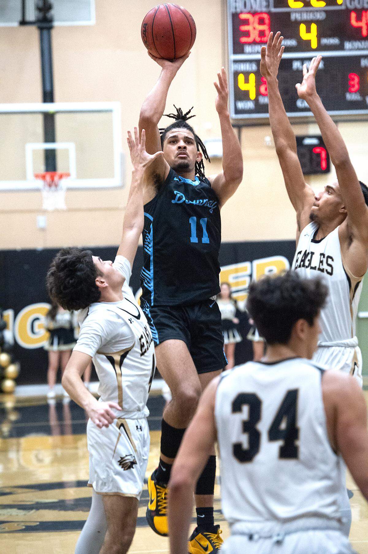 Downey’s Lloyd French scores two of his 17 points during the Central California Athletic League with Enochs at Enochs High School in Modesto, Calif., Friday, Jan. 27, 2023.