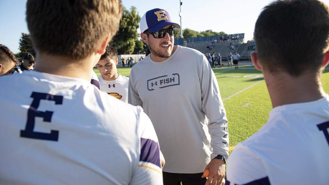 Escalon coach Andrew Beam talks with his team in the offensive huddle during the Friday Knights Lights passing tournament at Downey High School in Modesto, Calif., Friday, June 29, 2019.