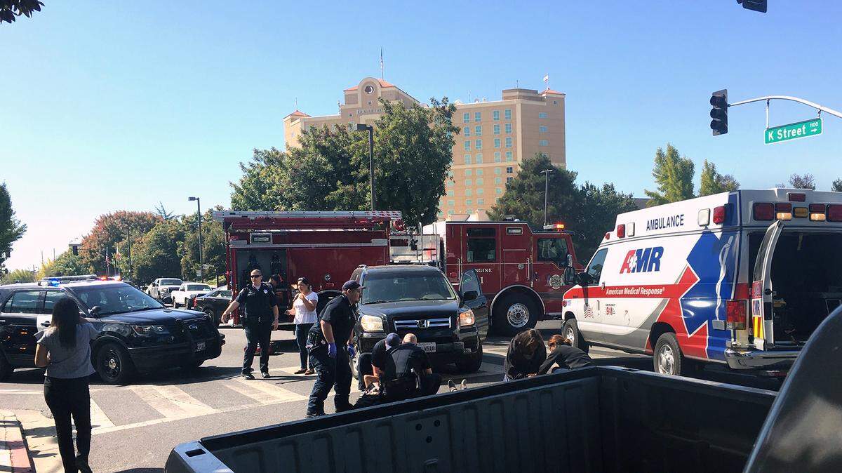Emergency crews work the scene Monday October 7, 2019 of an accident at 11th and K streets in downtown Modesto, Calif. where two pedestrians were hit by an SUV.