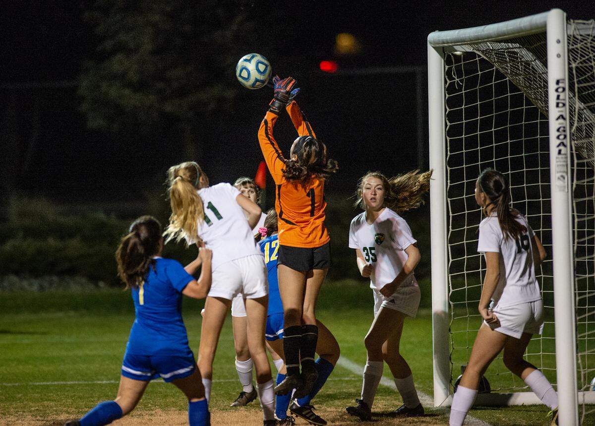 Mariposa County goalie Theresse Mandin (1) blocks a shot during the Division VI playoff game with Ripon Christian at Ripon Christian High School in Ripon, Calif., on Wednesday, Feb. 16, 2022. Mariposa County won the game 3-2.