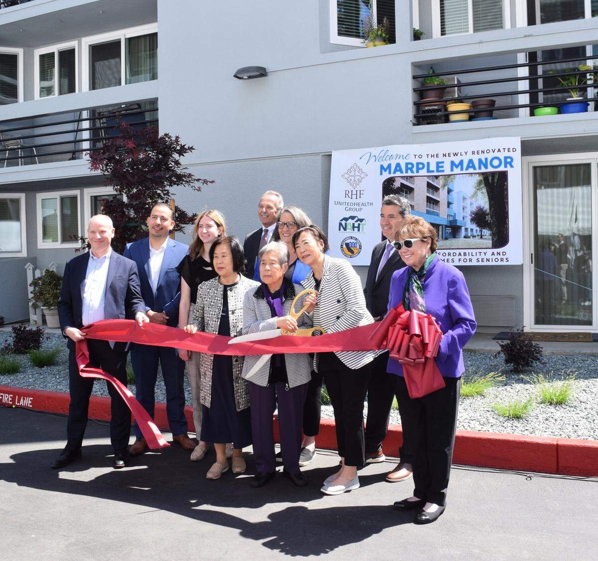 Sponsors and attendees, including Jorge Esquivel, Abigail Pendleton, Stuart Hartman, Mayor Sue Zwahlen, Paul Cummings and Ann Veneman, cut the ribbon with Marple Manor resident Young Baek on April 23, 2025.