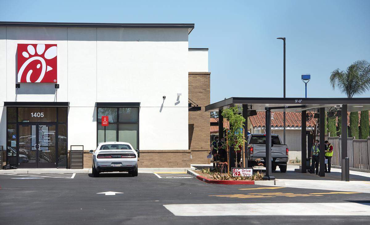 Employees conduct training session at a Chick-fil-A restaurant in Manteca, California, in April 2020. The chain is among those fighting a bill from Assemblyman Chris Holden that would hold corporations liable for employee mistreatment.