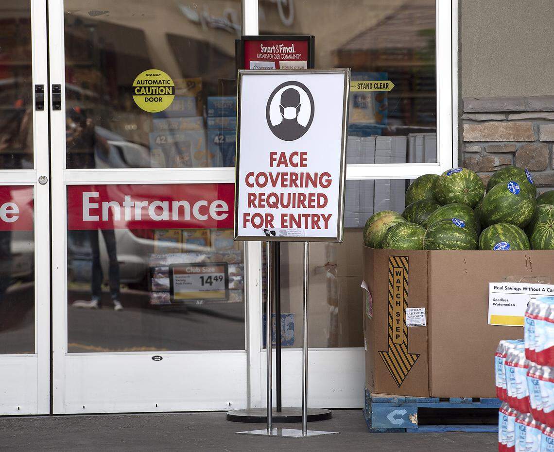 Shoppers and employees are now required to wear a face covering at Smart & Final store in Modesto, Calif., on Wednesday, April 29, 2020.