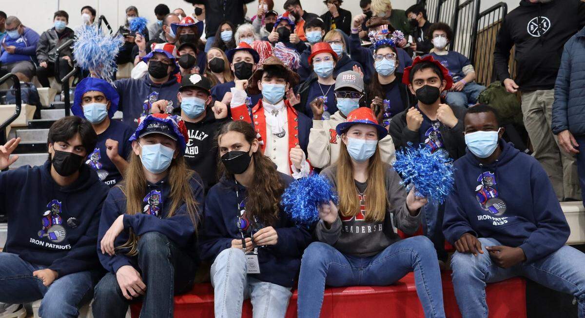 Iron Patriots team members watch a match at a regional robotics competition March 23-26 in Monterey Bay.