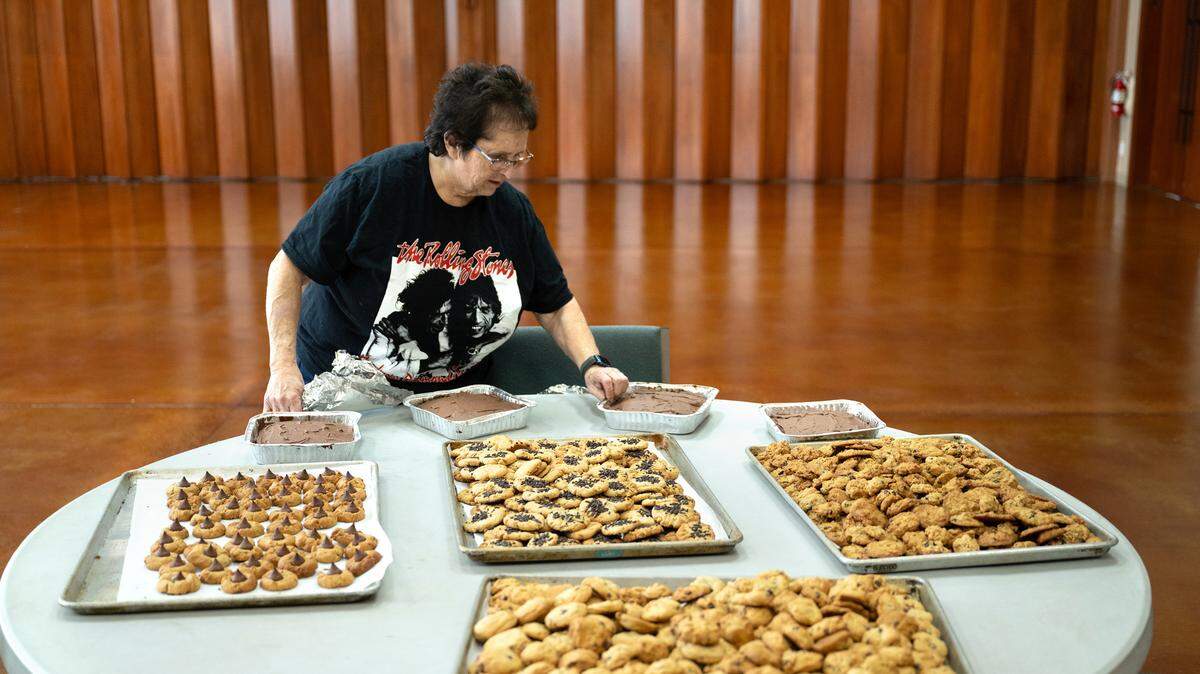 Joyce Gandelman prepares cookies and brownies for delivery as she and other volunteers make a holiday meal for first responders at Congregation Beth Shalom synagogue in Modesto, Tuesday, Dec. 24, 2024. Members of the congregation plan to deliver meals to area first responders Christmas Eve night.