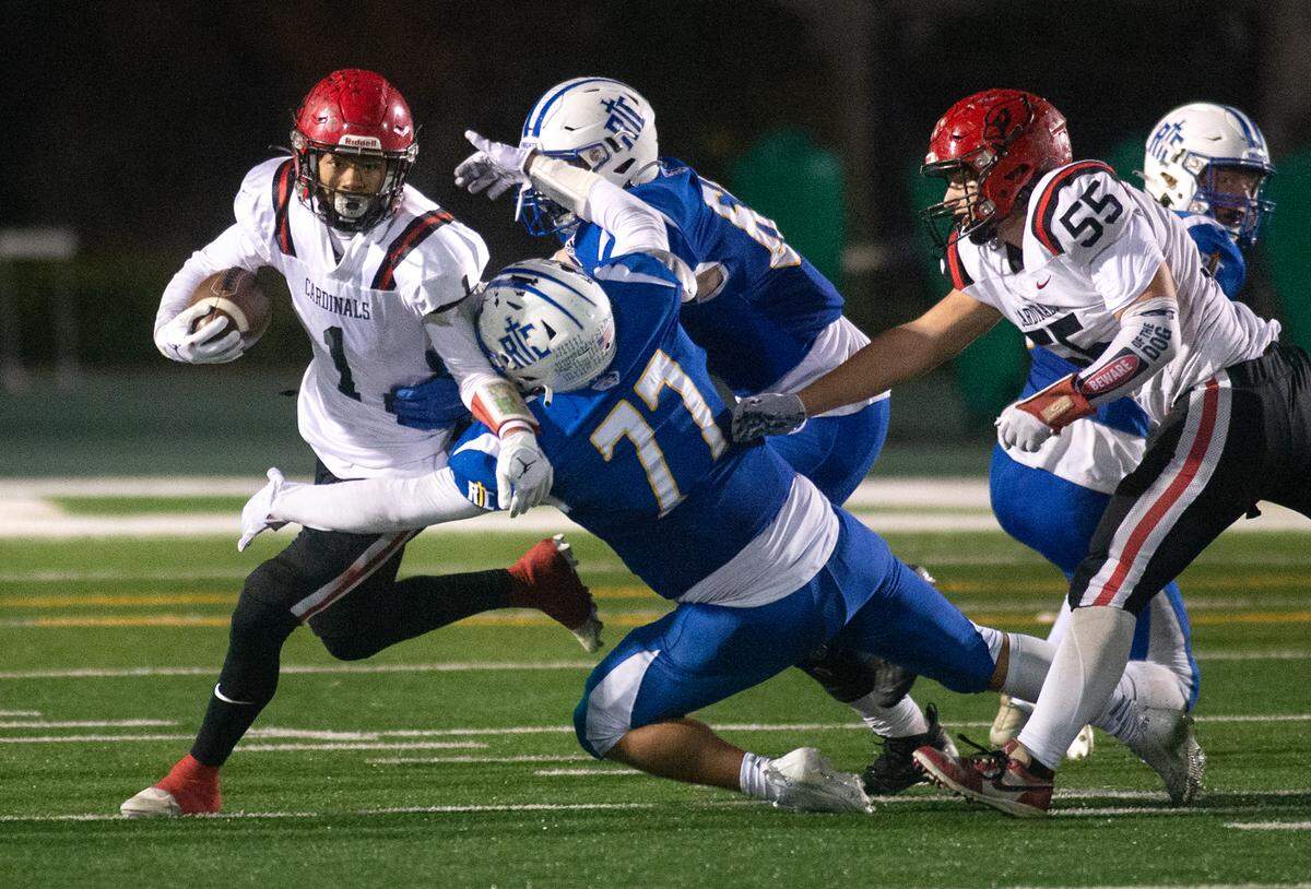 Woodland Christian’s Billy Hinkle battles with Ripon Christian defender Cote Windorski during the Sac-Joaquin Section Division VII championship game with Ripon Christian at St. Mary’s High School in Stockton, Calif., Friday, Nov. 25, 2022.