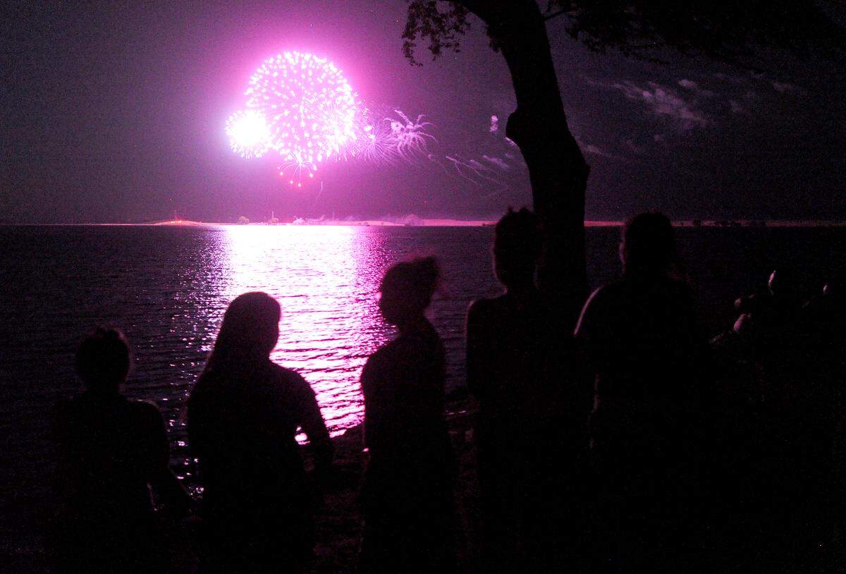 Families and friends gathered on the shores of Woodward Reservoir just outside of Oakdale for a past year's Fourth of July fireworks show.