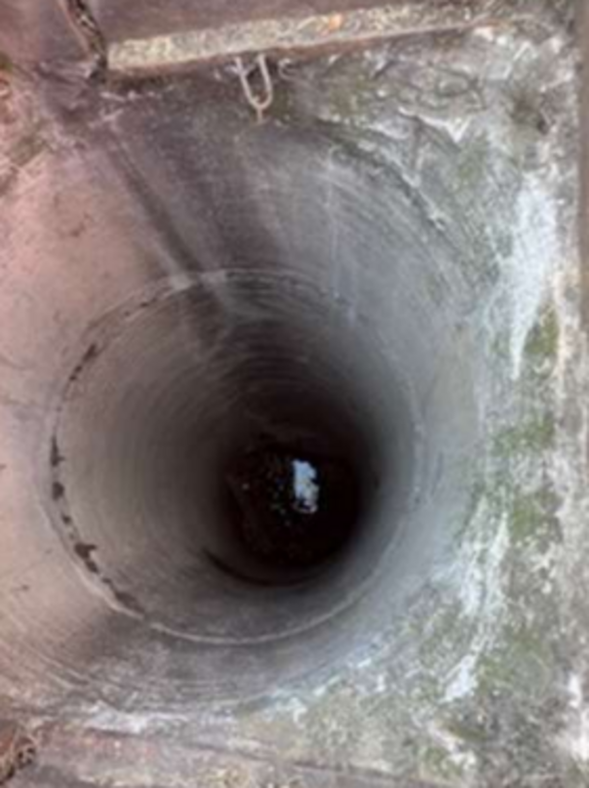 A photo of the 12-foot drainage pipe that an Amazon delivery driver fell into as he stepped out of his vehicle in Oakdale on Thursday, May 16, 2024.