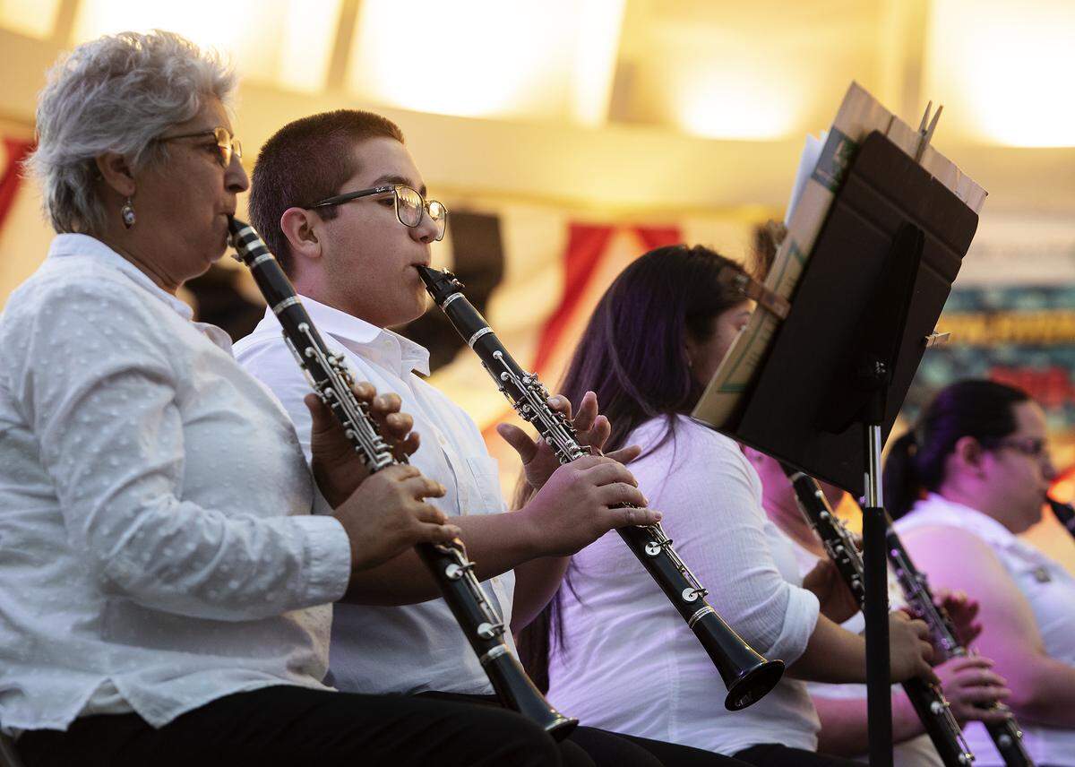 Alexander Cibriani, 15, middle, plays the clarinet with MoBand at Graceada Park in Modesto, Calif., Thursday, June 6, 2019.
