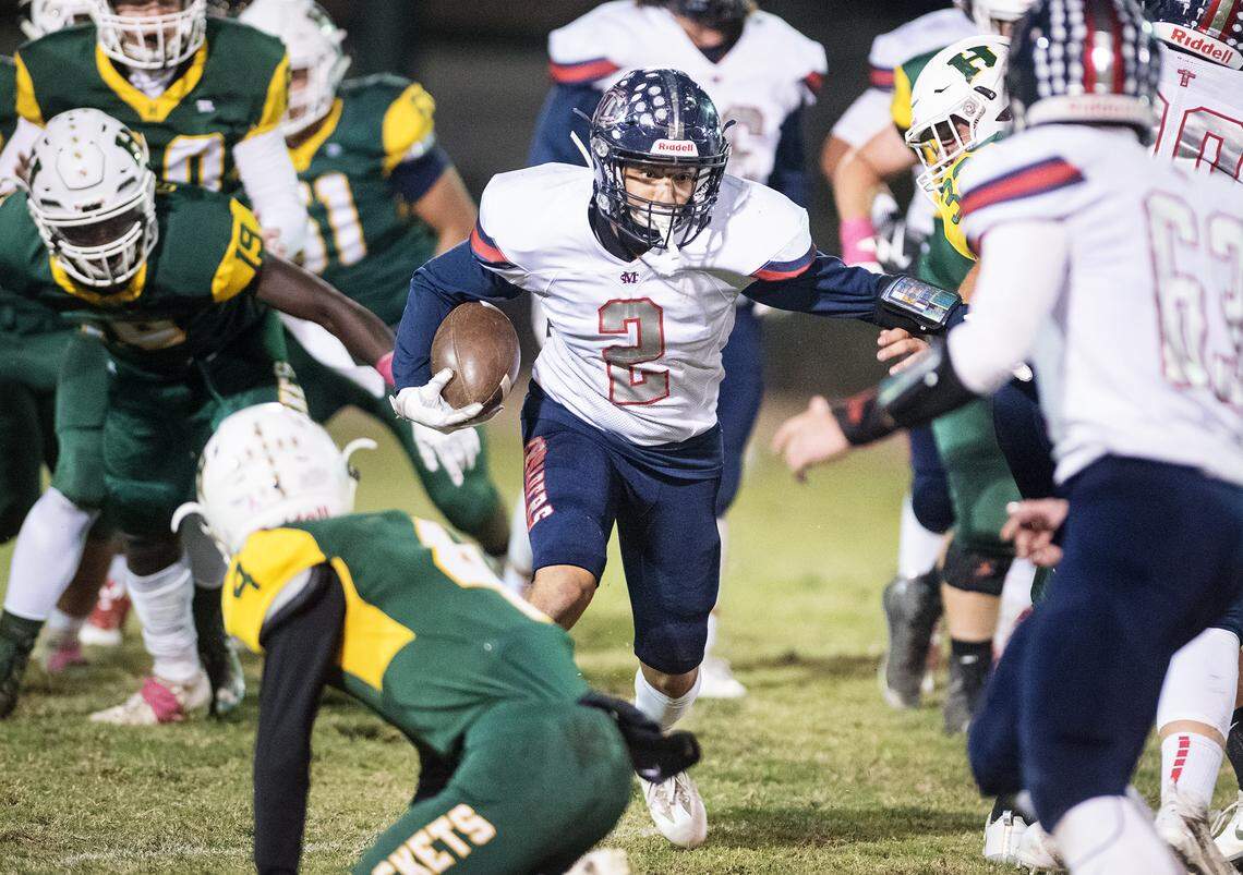 Modesto Christian’s Jose Hernandez finds a gap and finds the end zone on a 64-yard run during the Trans Valley League game at Hilmar High School in Hilmar, Calif., on Friday, Oct. 12, 2018. Modesto Christian won the game 24-21.