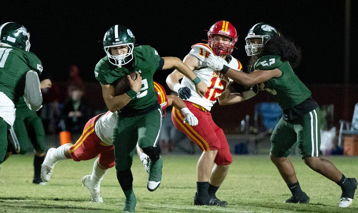 Manteca’s Nikko Juarez runs the ball during the Valley Oak League game with Oakdale at Manteca High School in Manteca, Friday, Nov. 1, 2024.