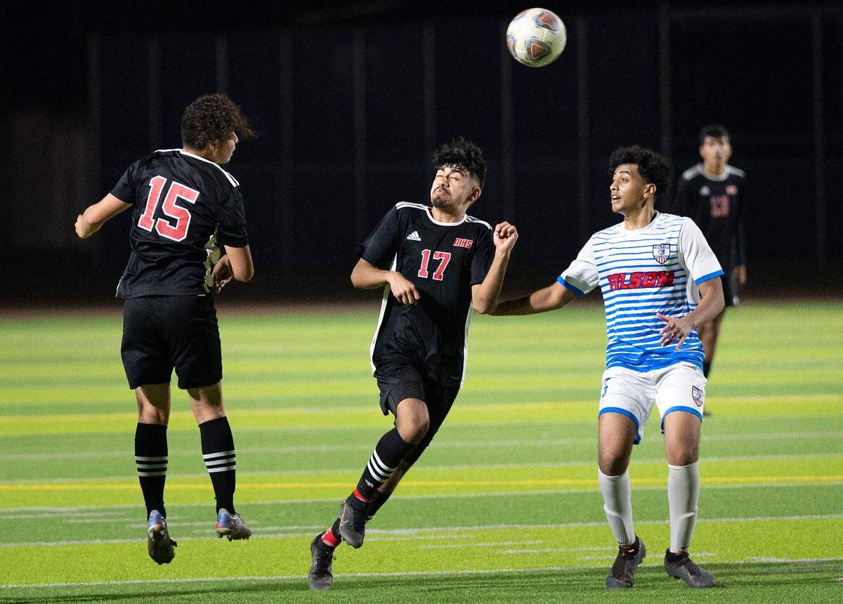 Modesto’s Salvador Soto, (15) heads the ball in front of teammate Ricardo Galan (17) and Folsom’s Zaid Abdul-Quddus during the Sac-Joaquin section playoff game at Downey High School in Modesto, Calif., on Thursday, Feb. 10, 2022. Modesto won the first-round game 3-0.