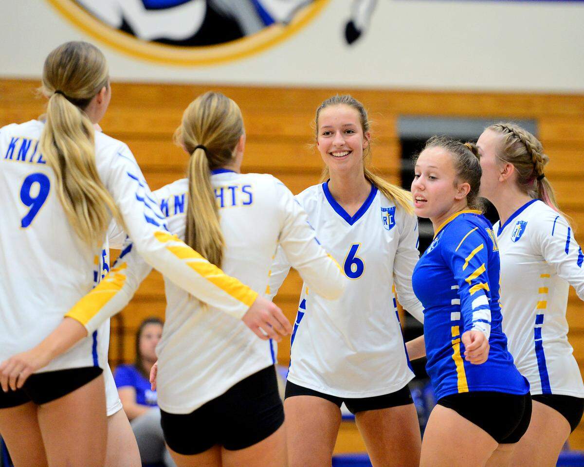 Ripon Christian’s Megan Weststeyn (6) smiles while celebrating a point with her teammates during a game between Ripon Christian and Mariposa at Ripon Christian High School in Ripon California on September 19, 2023.
