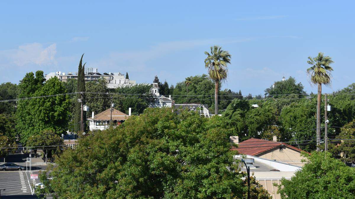 A mostly clear sky over downtown Modesto on Sunday, May 12, 2019 will be cloudy by midweek, the National Weather Service says. The clouds are expected to bring the first rain of the month.