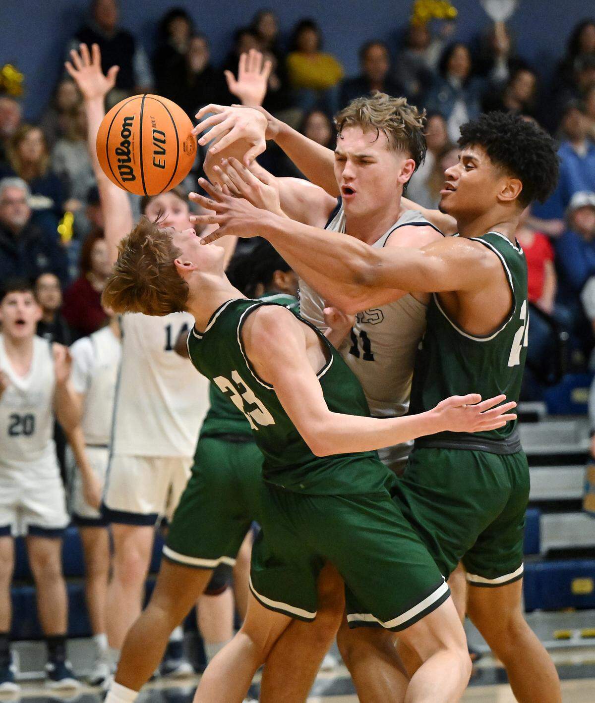 Central Catholic’s TP Wentworth is swarmed by Manteca’s Peyton Nieman (23) and Elijah Nelson (24) during the Valley Oak League game at Central Catholic High School in Modesto, Calif., Wednesday, Feb. 7, 2024.