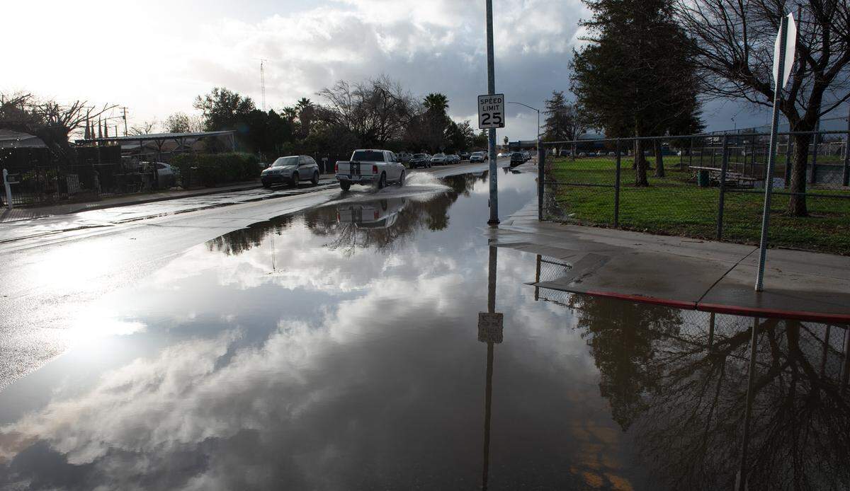 Street flooding from the recent storm has been a problem for residents in south Modesto, Calif., Tuesday, Jan. 10, 2023.