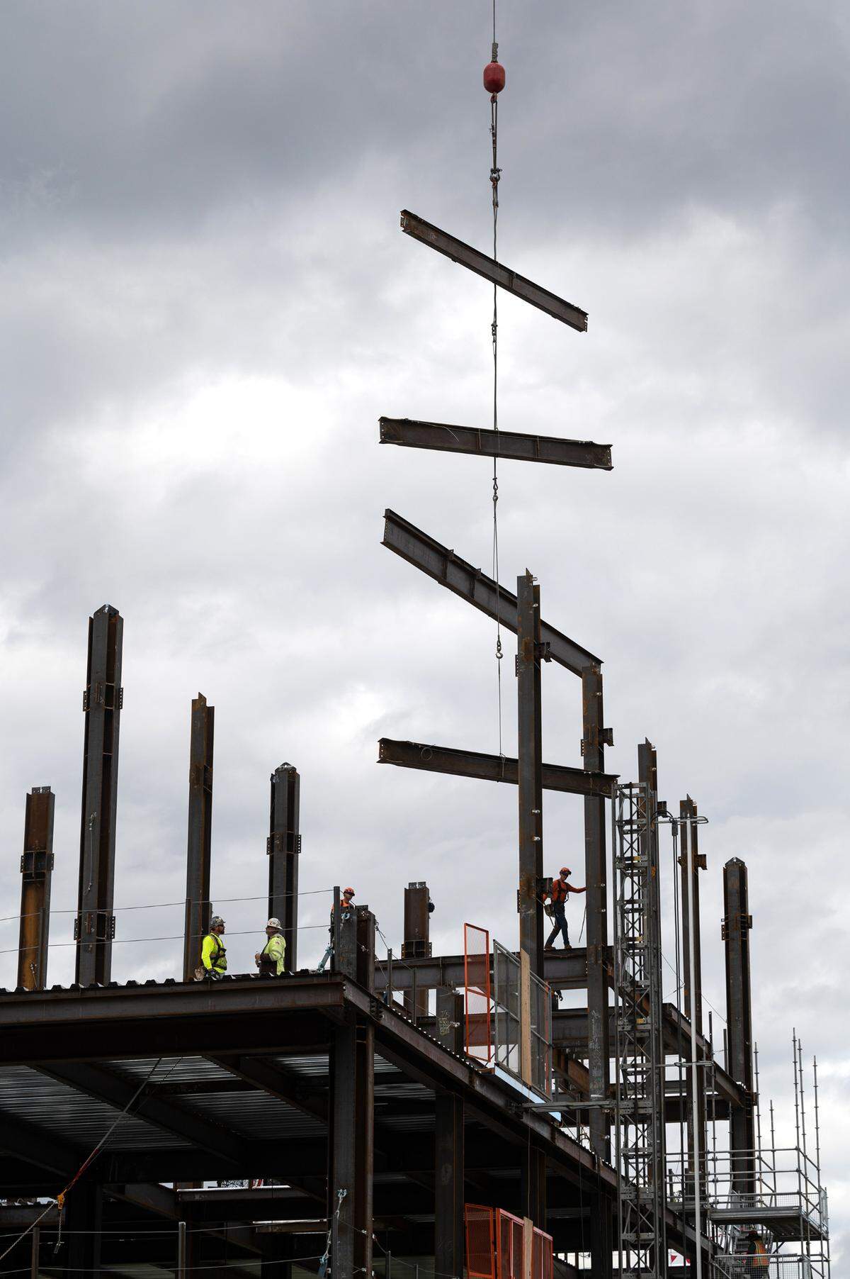 A crew works on the construction of the steel framing the new courthouse in downtown Modesto, Calif., Wednesday, Nov. 9, 2022.