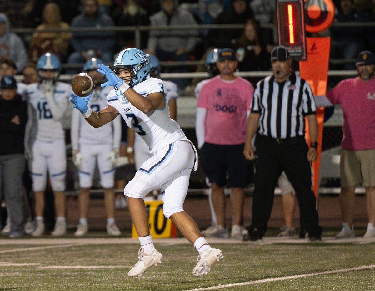 Downey’s RayMelo Thurman makes a catch during the Central California Athletic League game with Turlock at Turlock High School in Turlock, Friday, Oct. 18, 2024.