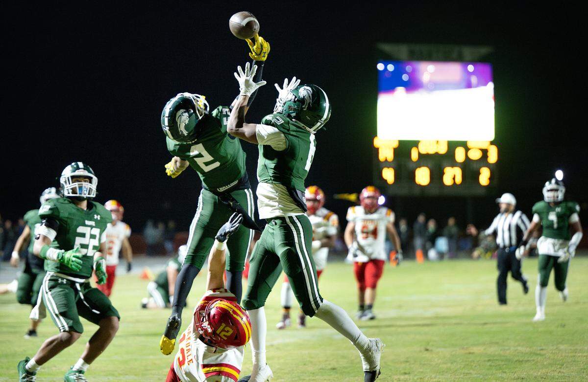 Manteca’s Quinn Martinez (2) breaks up a pass during the Valley Oak League game with Oakdale at Manteca High School in Manteca, Friday, Nov. 1, 2024.