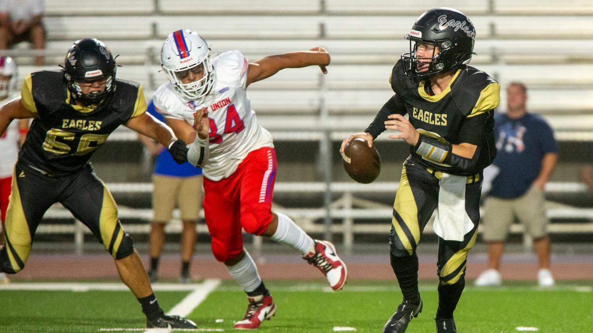 Johnny Staggs, 2, of Enochs High looks upfield for an open man during Friday Sept. 13, 2024 game against East Union. 