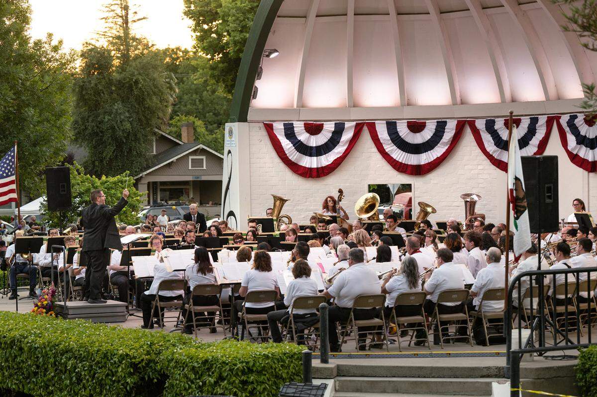 Assistant conductor, Brad Hart leads MoBand during its first concert of the season at Mancini Bowl in Graceada Park in Modesto, Calif., Thursday, June 8, 2023.
