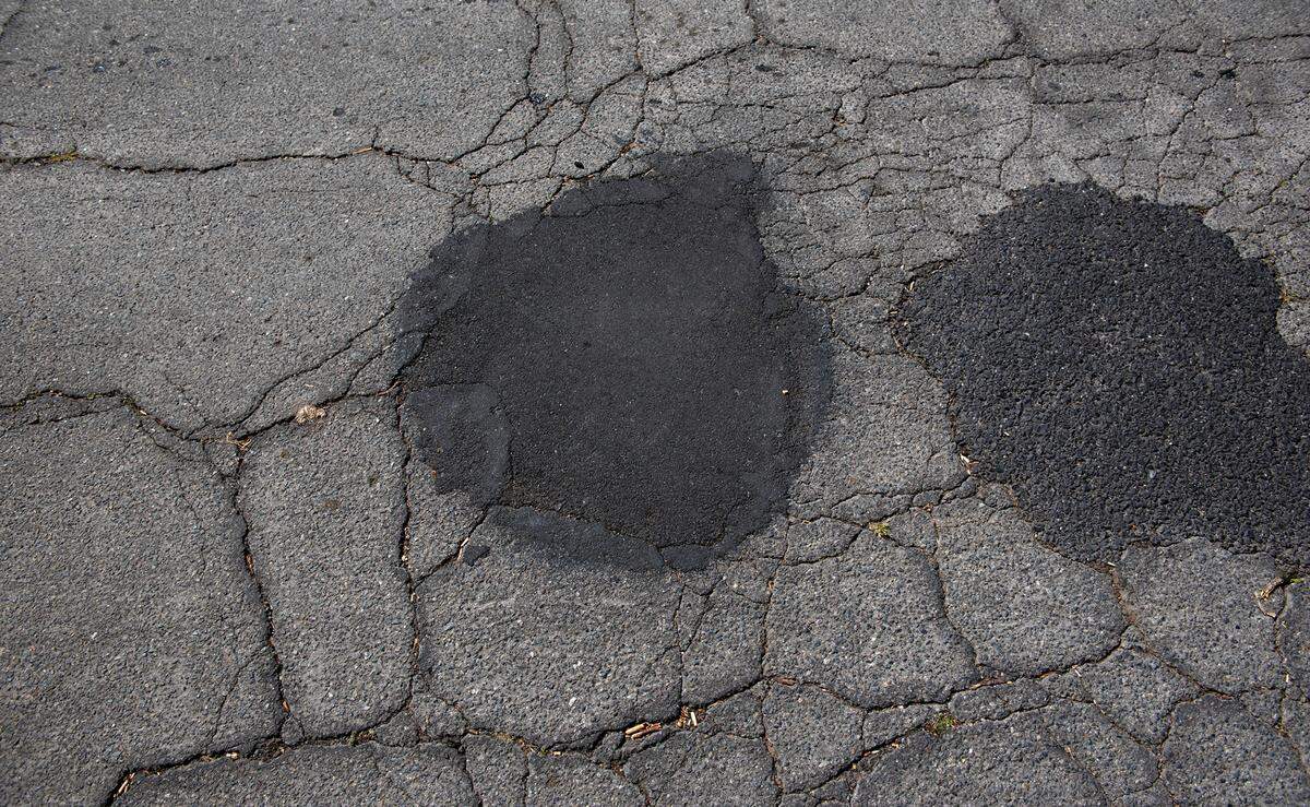Repaired potholes on Brady Avenue in Modesto, Calif., Thursday, April 13, 2023.