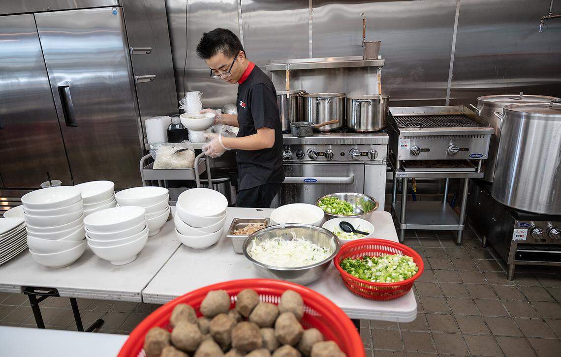 Owner Thuan Do prepares pho at The Pho restaurant on Oakdale Road in Modesto, Calif., on Wednesday, June 9, 2021.