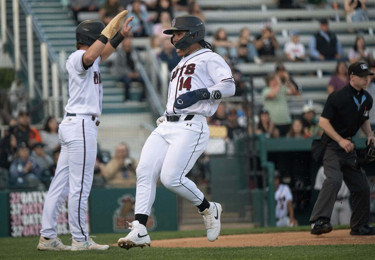 Modesto Nuts’ Michael Arroyo scores on a Thai Peete double during season home opener with Lake Elsinore at John Thurman Field in Modesto, Calif., Tuesday, April 9, 2024.