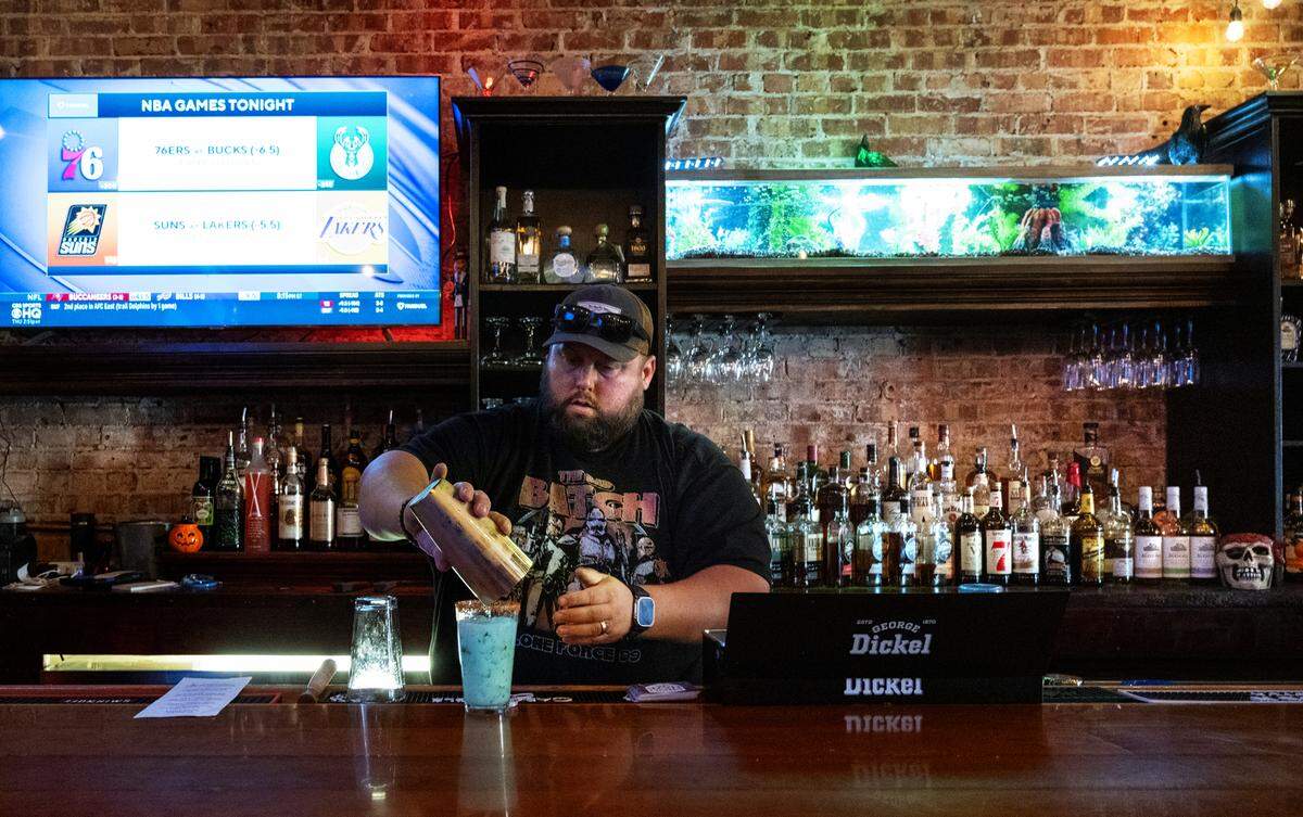 Bartender Griffin Dye makes a cocktail at The Goat Bar & Grill on 10th Street in Modesto, Calif., Thursday, Oct. 26, 2023.