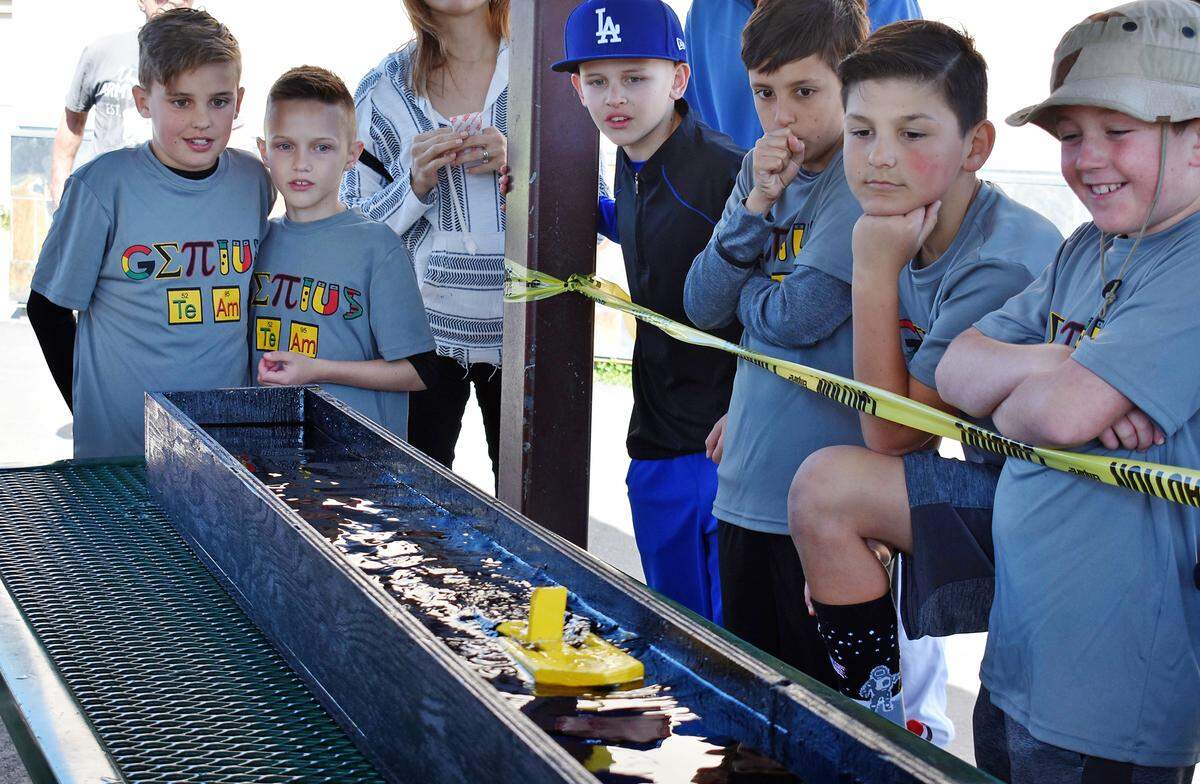 Teammates and cousins Cole and Cameron Kelley, both in fourth grade at Walnut Elementary, watch their entry in the paddleboat race at the 22nd annual Stanislaus County Elementary Science Olympiad at their Turlock school on Saturday, March 30, 2019.