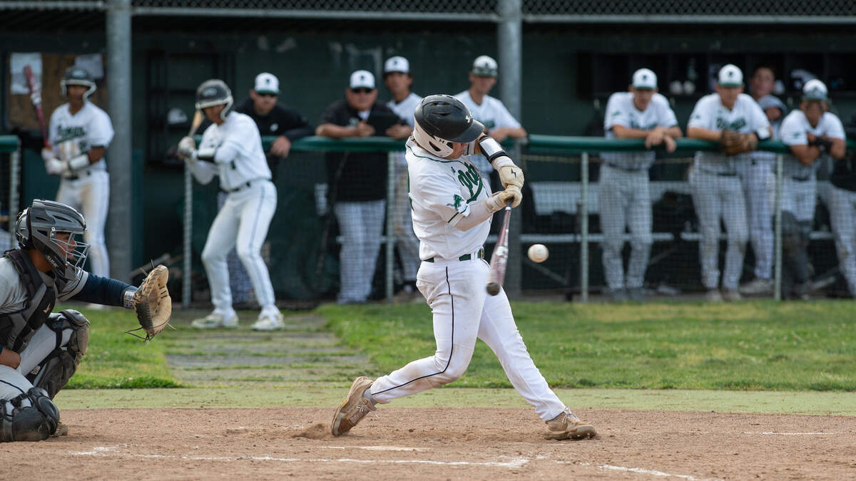Pitman’s Dominic Damante singles during the Central California Athletic League game with Downey at Pitman High School in Turlock, Calif., Tuesday, May 2, 2023. Pitman won the game 7-2.
