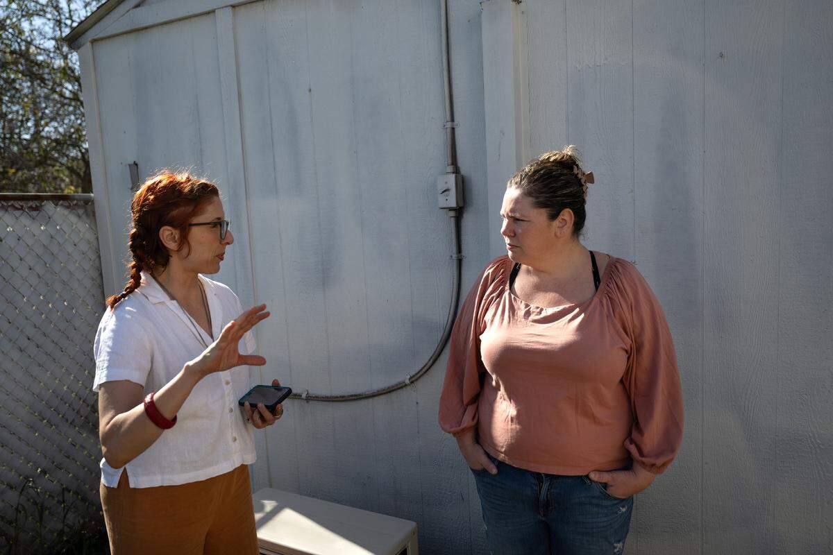 Emily Petersen, right, talks with Sara Bernal from the Valley Water Collaborative during water testing at the Petersen home in Stanislaus County, Thursday, April 10, 2025. 