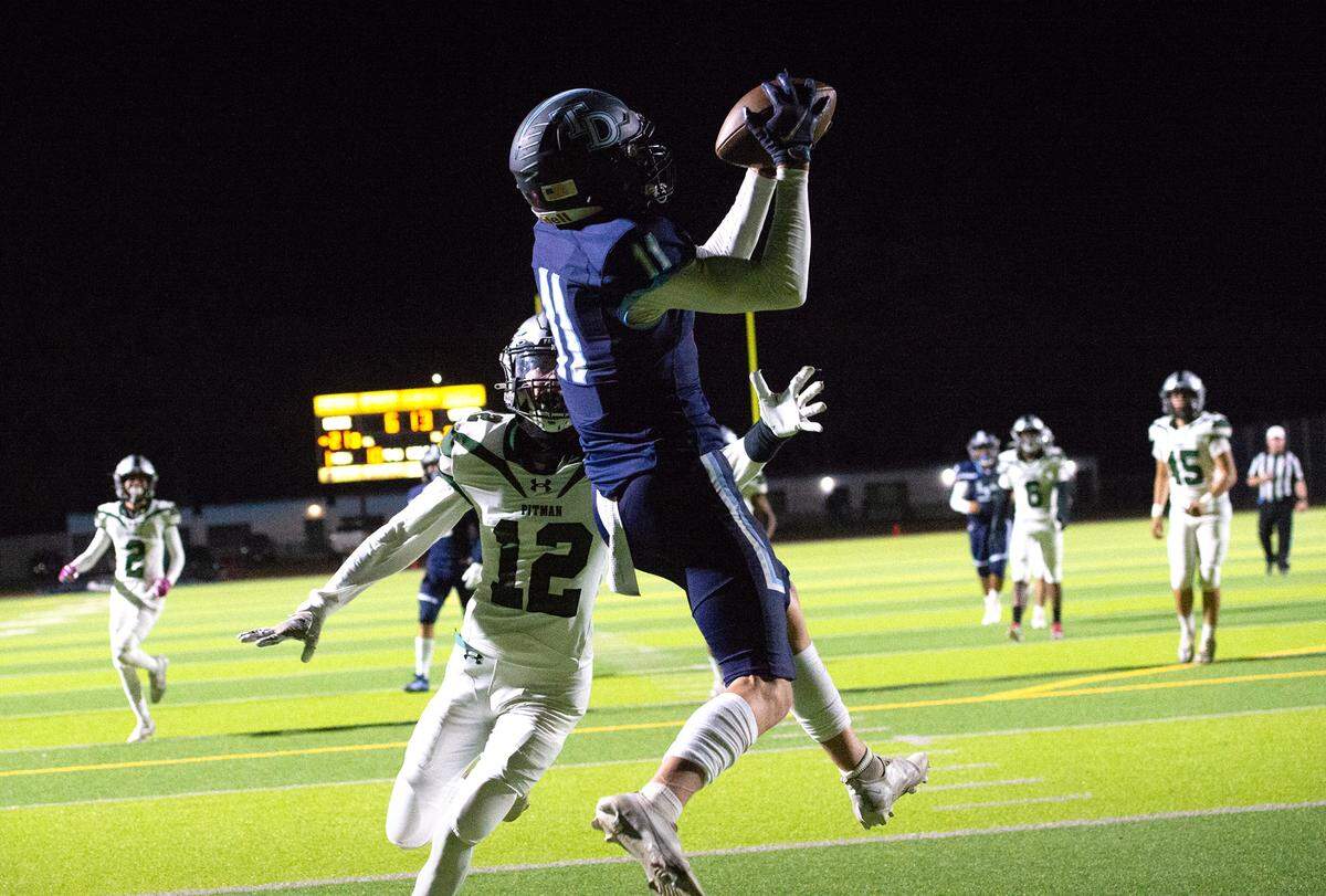 Downey’s Ethan Woodmansee makes a catch in the end zone during the Central California Athletic League game with Pitman at Downey High School in Modesto, Calif., Friday, Oct. 28, 2022.