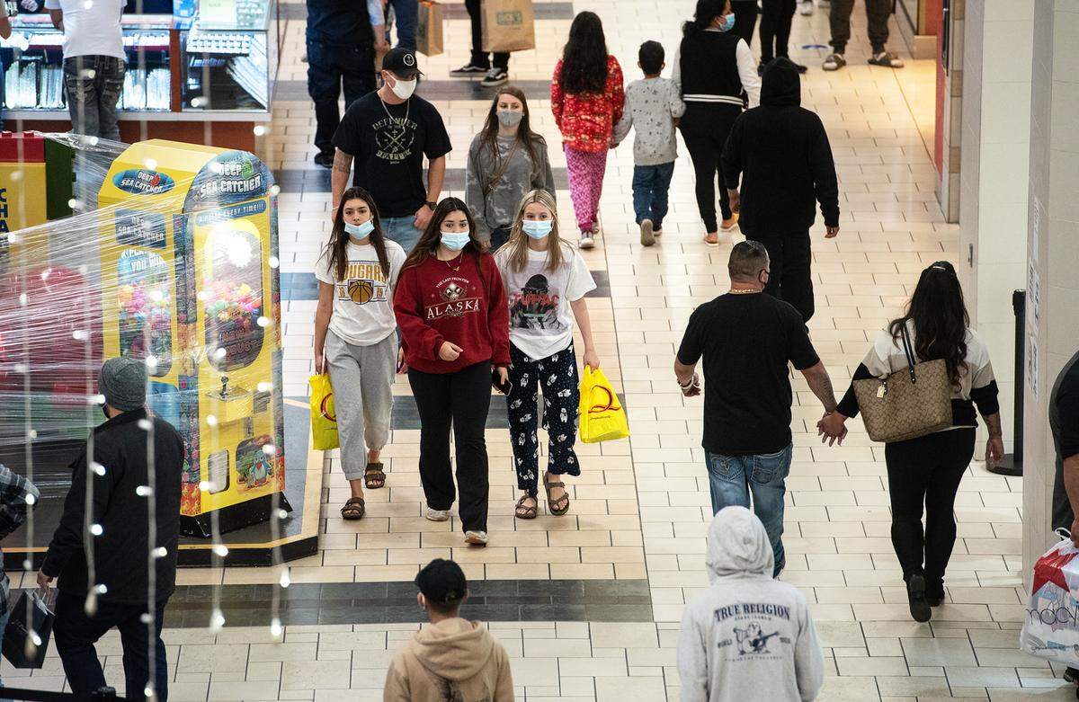 People shop at Vintage Faire Mall in Modesto, Calif., on Friday, Nov. 27, 2020.