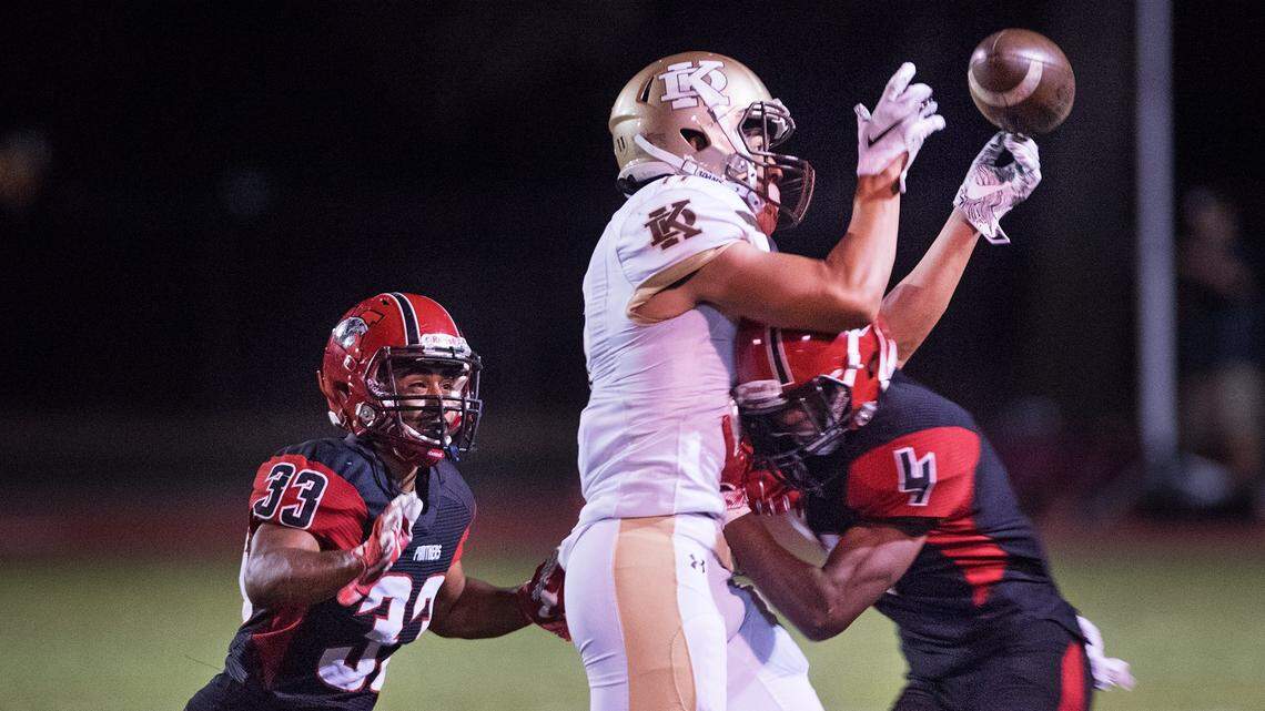 Modesto’s Jaquile Ingram breaks up a pass to Stagg’s Keith Smith during a non-league game at Downey High School in Modesto, Calif., on Friday, Sept. 21, 2018. 