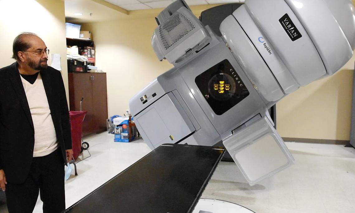 Dr. Amarjit Dhaliwal with the medical linear accelerator which is used to treat cancer tumors with targeted radiation. Photographed at the Valley Cancer Medical Center in Manteca, Calif., Wednesday, Jan. 23, 2023.