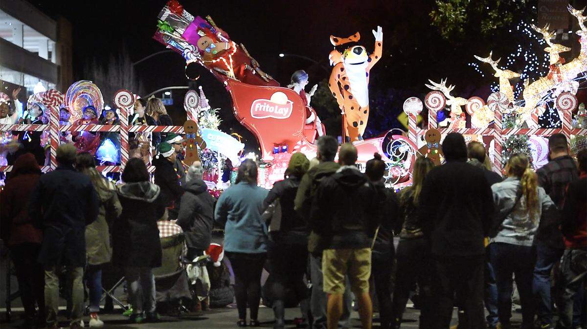 Frito Lay float passes the crowd on J Street during the Celebration of Lights Parade in Modesto, Calif., Saturday, Dec. 7, 2019.