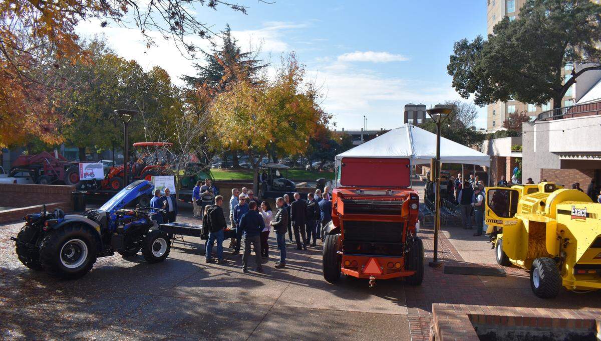 Several tractors, harvesters, utility task vehicles and other low-emission pieces were displayed outside Modesto Centre Plaza on Wednesday, Nov. 29, 2023, for a clean air ag equipment showcase.