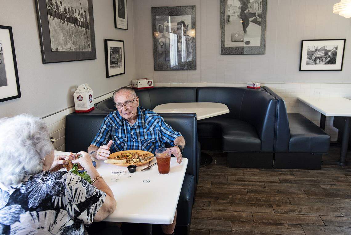 Gary Perry, right, and Sharon Cardinal eat lunch at Velvet Creamery in Modesto, Calif., on Wednesday, May 20, 2020.