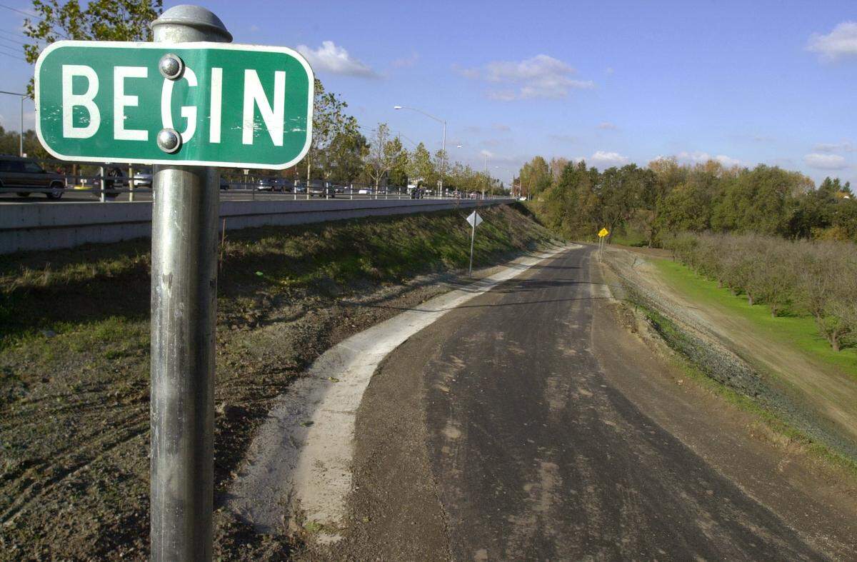 The eastern entrance to the Mensinger trail next to the Claus Road over pass of Dry Creek in Modesto.