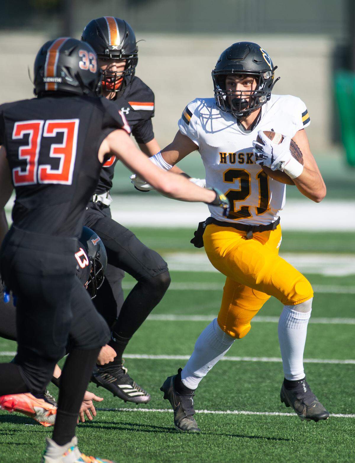 Hughson’s David Delgado runs the ball during the Sac-Joaquin Section Division VI championship game with Summerville at St. Mary’s High School in Stockton, Calif., Saturday, Nov. 26, 2022.