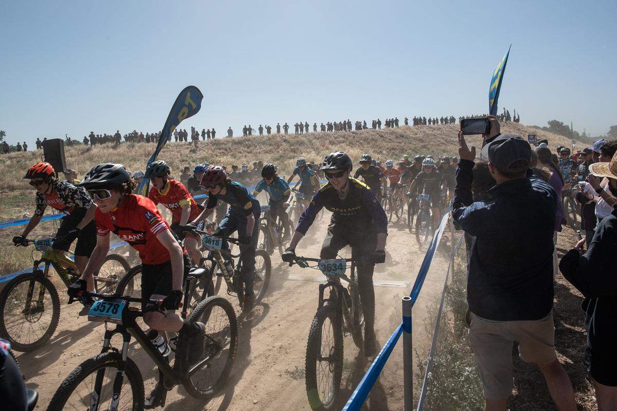 Riders start the boys sophomore division 2 mountain bike race at Tuolumne River Regional Park during the NorCal Interscholastic Cycling League event in Modesto, Calif., on Saturday, April 9, 2022. 